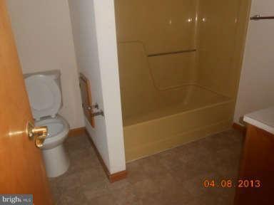 7384 Station Road Newcomb, MD 21653 - Photo 10 of 10 a bathroom with a toilet and a shower
