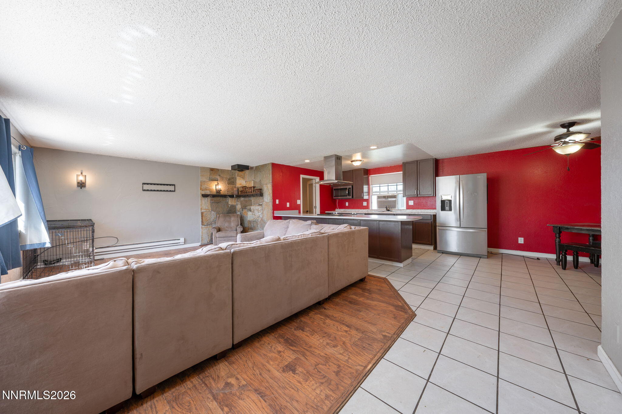 3590 Siskin Lane Reno, NV 89508 - Photo 6 of 31 a kitchen with kitchen island granite countertop a sink counter top space and cabinets