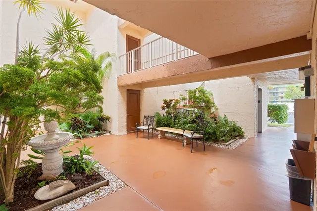a view of a chairs and table in the patio