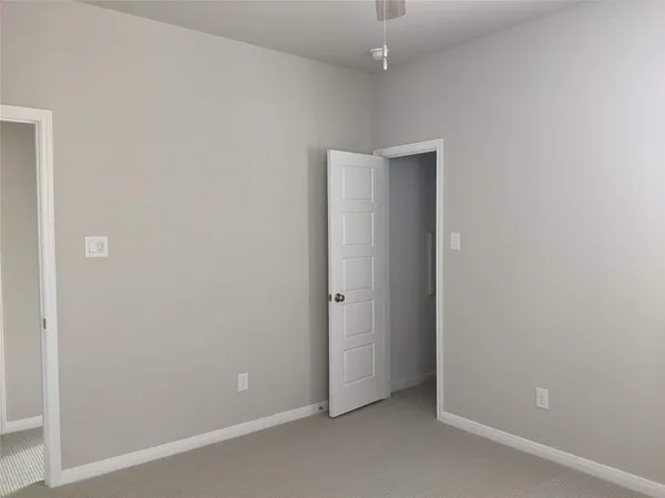 an empty room with a bathroom