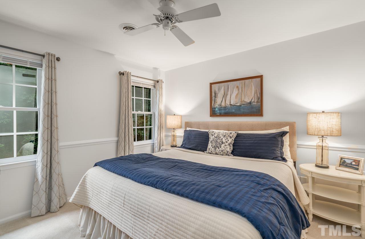 301 Pasture Lane Raleigh, NC 27614 - Photo 22 of 29 a bedroom with a large bed and a window