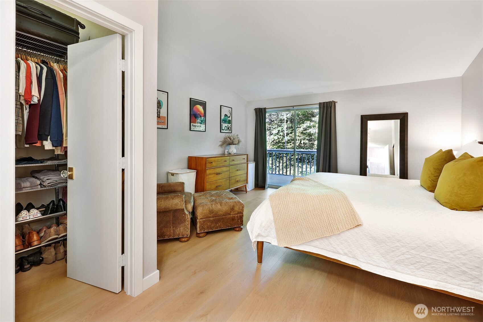 5126 South Garden Loop Road, Unit 11 Seattle, WA 98118 - Photo 20 of 36 a bedroom with a bed and dresser