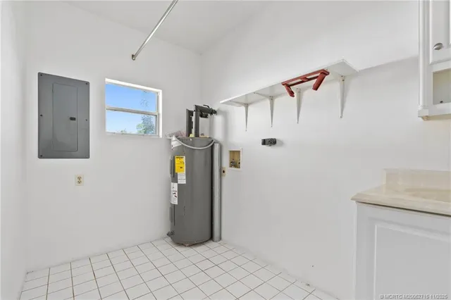 a view of a room with wooden floor and white walls