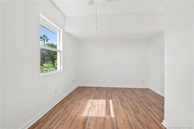a view of a room with wooden floor and closet
