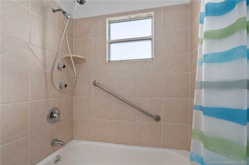 5801 Southeast Cable Drive Stuart, FL 34997 - Photo 28 of 48 a bathroom with a shower