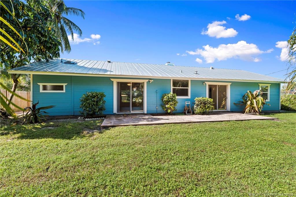 5801 Southeast Cable Drive Stuart, FL 34997 - Photo 37 of 48 a view of a house with backyard and sitting area