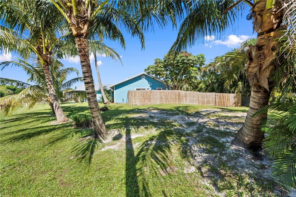 5801 Southeast Cable Drive Stuart, FL 34997 - Photo 41 of 48 a house view with a garden space
