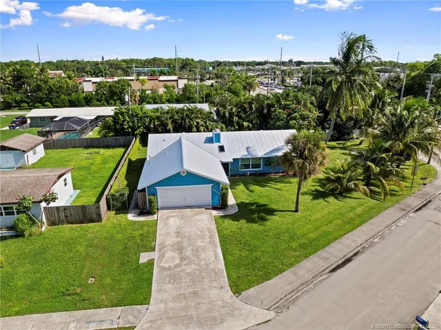 an aerial view of residential houses with outdoor space