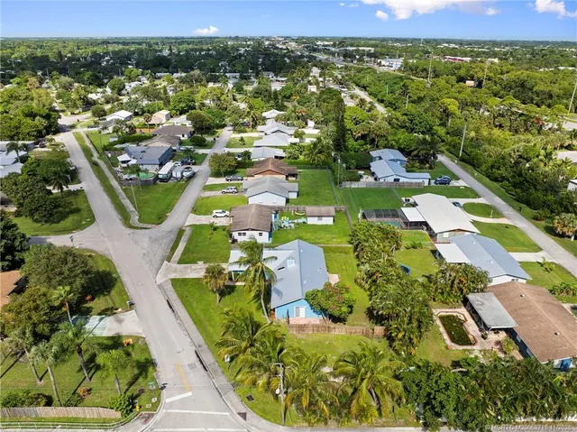 an aerial view of house with yard swimming pool and outdoor seating