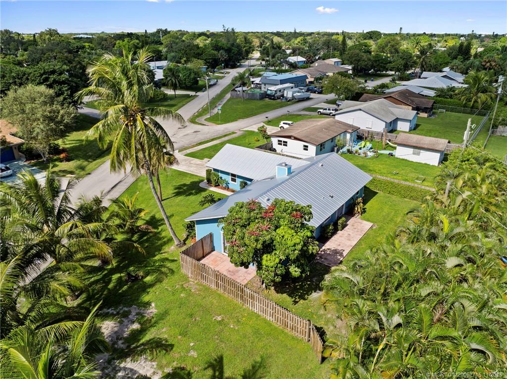 5801 Southeast Cable Drive Stuart, FL 34997 - Photo 47 of 48 an aerial view of residential houses with outdoor space and trees all around