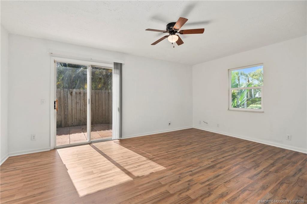 5801 Southeast Cable Drive Stuart, FL 34997 - Photo 9 of 48 a view of a room with wooden floor and ceiling fan