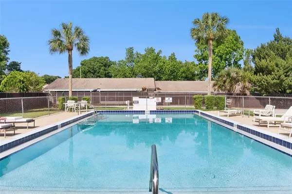 a view of a swimming pool with a lake view