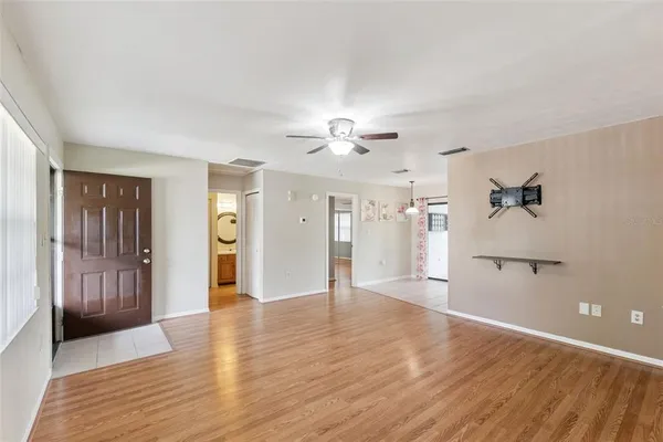 a view of a livingroom with wooden floor