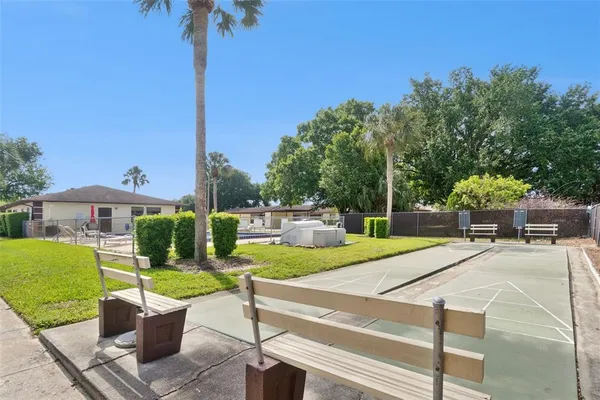 a view of a patio with a table and chairs
