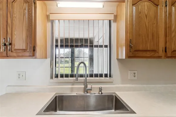 a bathroom with a sink and a window