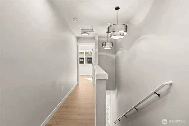 a view of a hallway with a chandelier