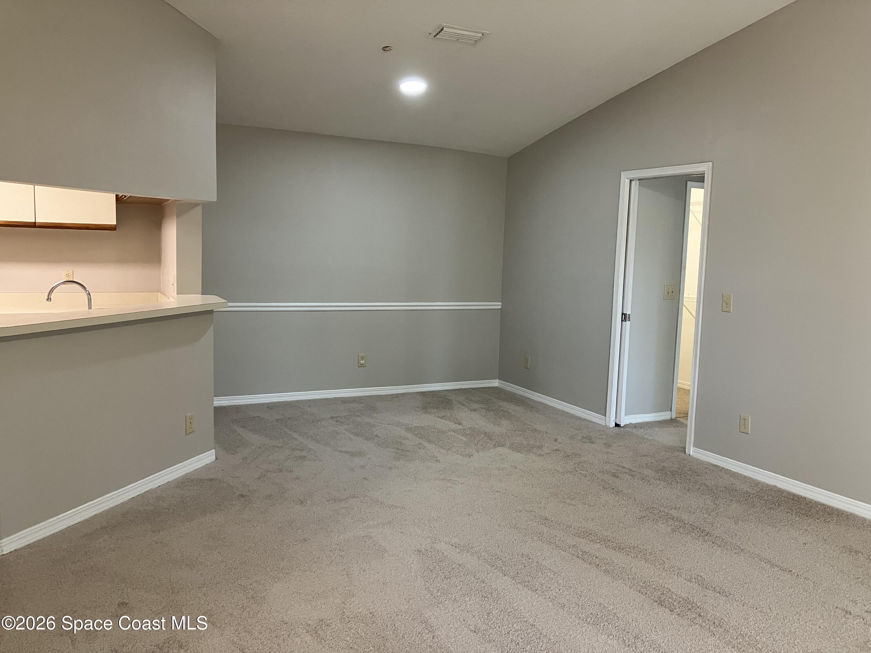 7667 North Wickham Road, Unit 1217 Melbourne, FL 32940 - Photo 8 of 18 Living/Dining Room