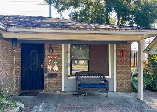 a view of sitting area in front of a house