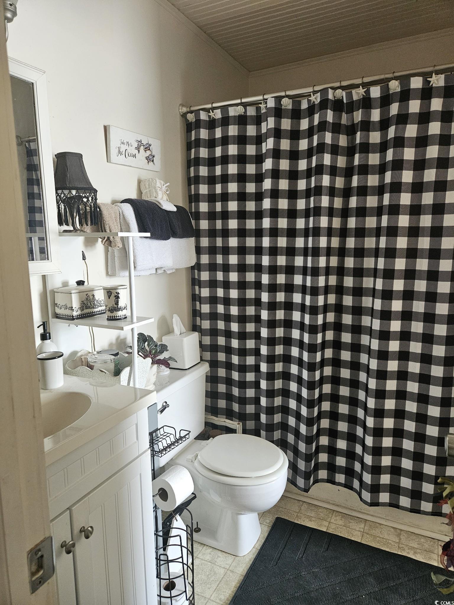801 Burcale Road, Unit B2 Myrtle Beach, SC 29579 - Photo 11 of 30 Bathroom featuring toilet, vanity, tile patterned