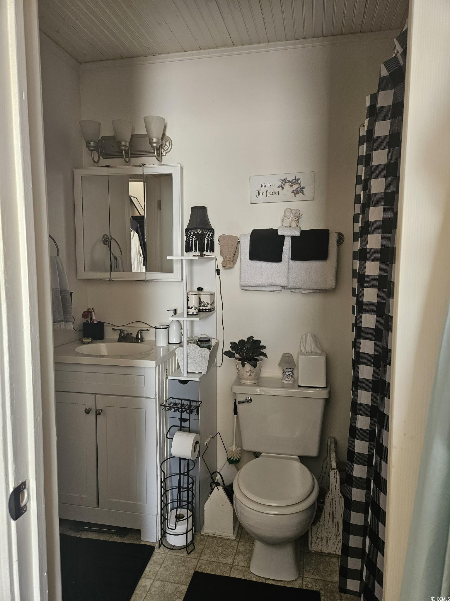 801 Burcale Road, Unit B2 Myrtle Beach, SC 29579 - Photo 10 of 30 Bathroom with tile patterned floors, vanity, and t