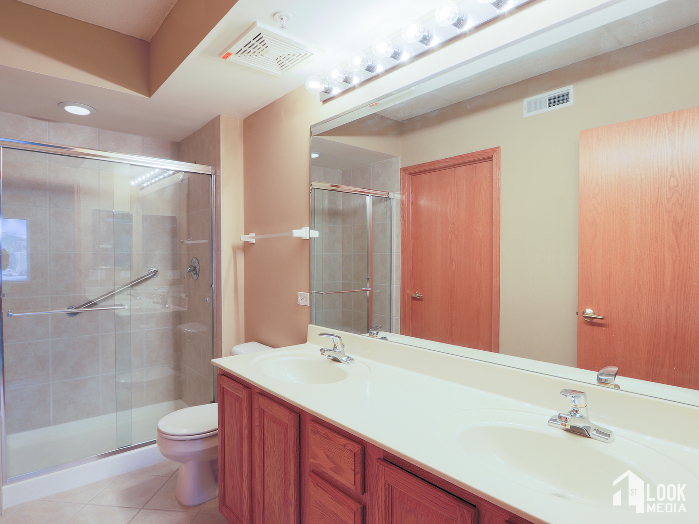 5 West Central Road, Unit 207 Mount Prospect, IL 60056 - Photo 11 of 29 a bathroom with a sink a toilet and shower