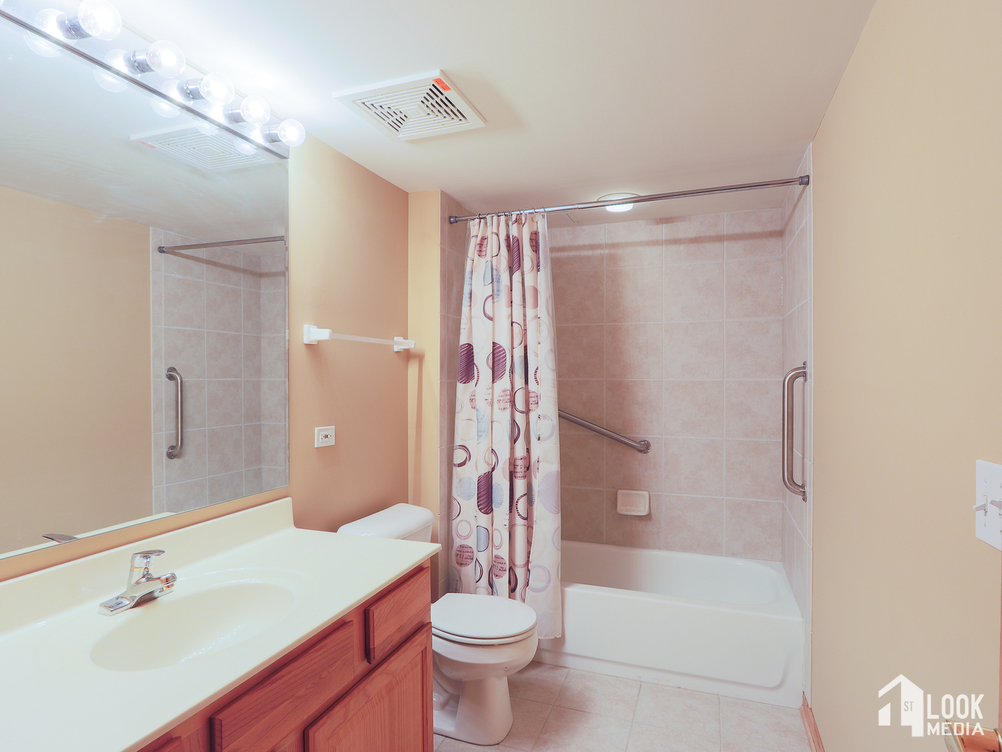5 West Central Road, Unit 207 Mount Prospect, IL 60056 - Photo 16 of 29 a bathroom with a sink a toilet and shower