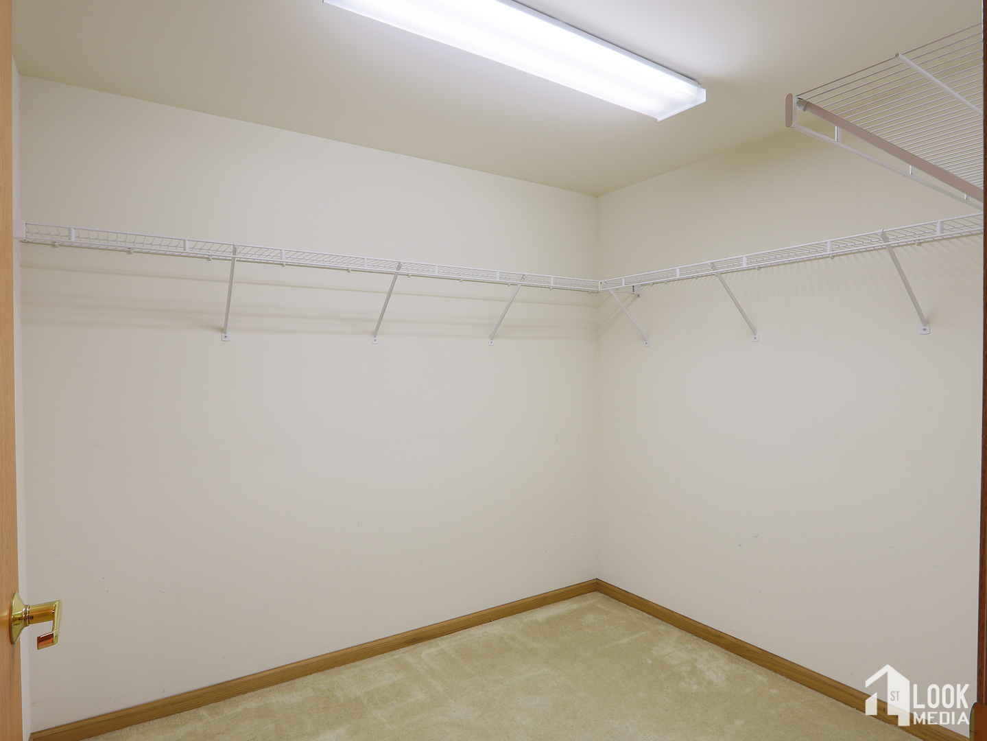 5 West Central Road, Unit 207 Mount Prospect, IL 60056 - Photo 18 of 29 a view of a room with racks on the wall