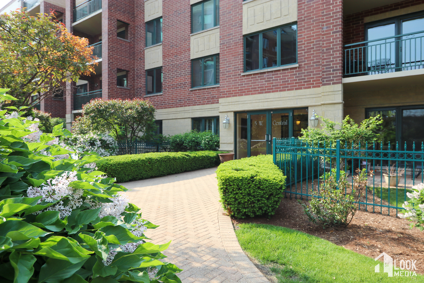 5 West Central Road, Unit 207 Mount Prospect, IL 60056 - Photo 29 of 29 a view of a garden with potted plants