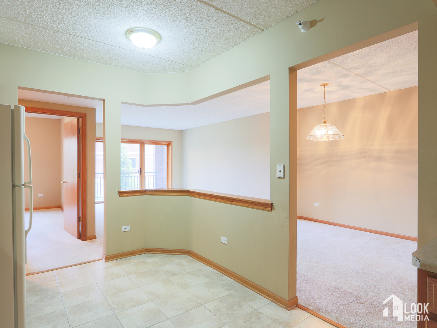 5 West Central Road, Unit 207 Mount Prospect, IL 60056 - Photo 8 of 29 a view of an empty room and window