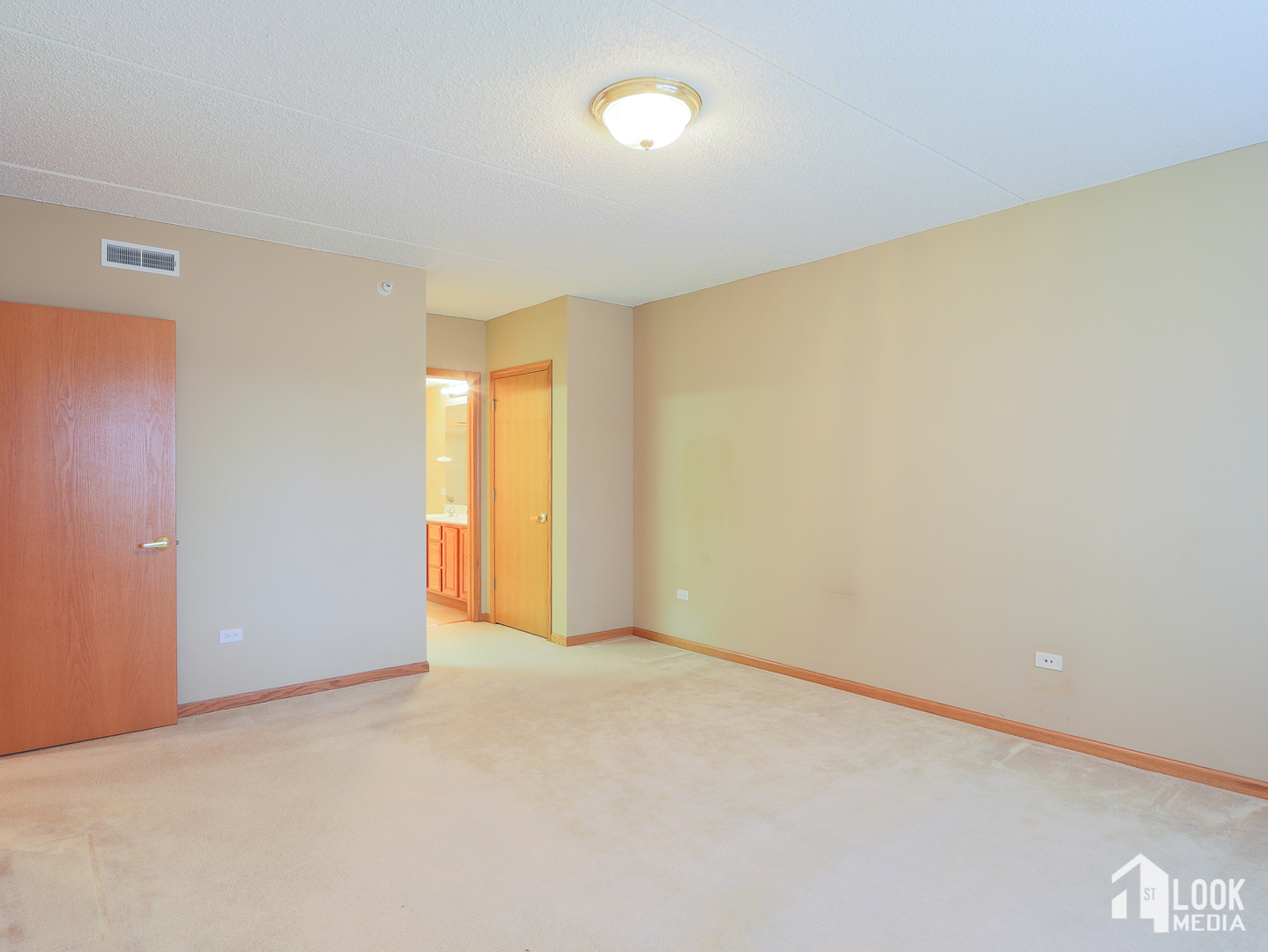 5 West Central Road, Unit 207 Mount Prospect, IL 60056 - Photo 10 of 29 a view of an empty room with a window