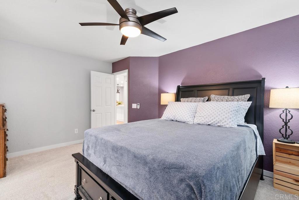 13981 Midland Road Poway, CA 92064 - Photo 11 of 26 a bedroom with a bed and a ceiling fan