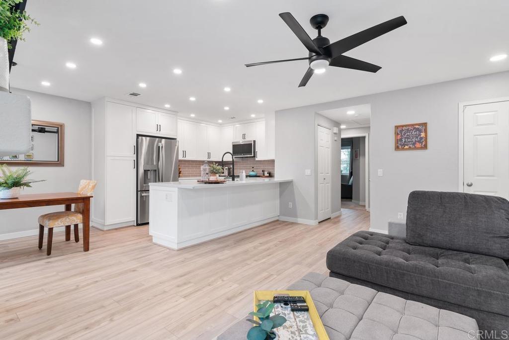 13981 Midland Road Poway, CA 92064 - Photo 2 of 26 a living room with furniture and kitchen view
