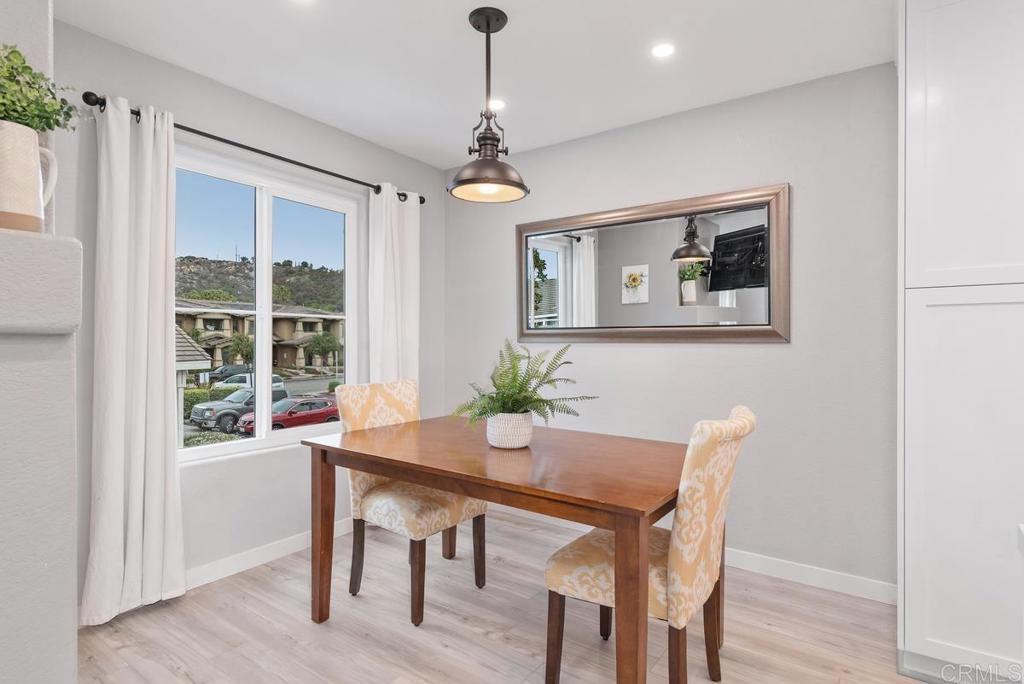 13981 Midland Road Poway, CA 92064 - Photo 7 of 26 a view of a dining room with furniture window and wooden floor