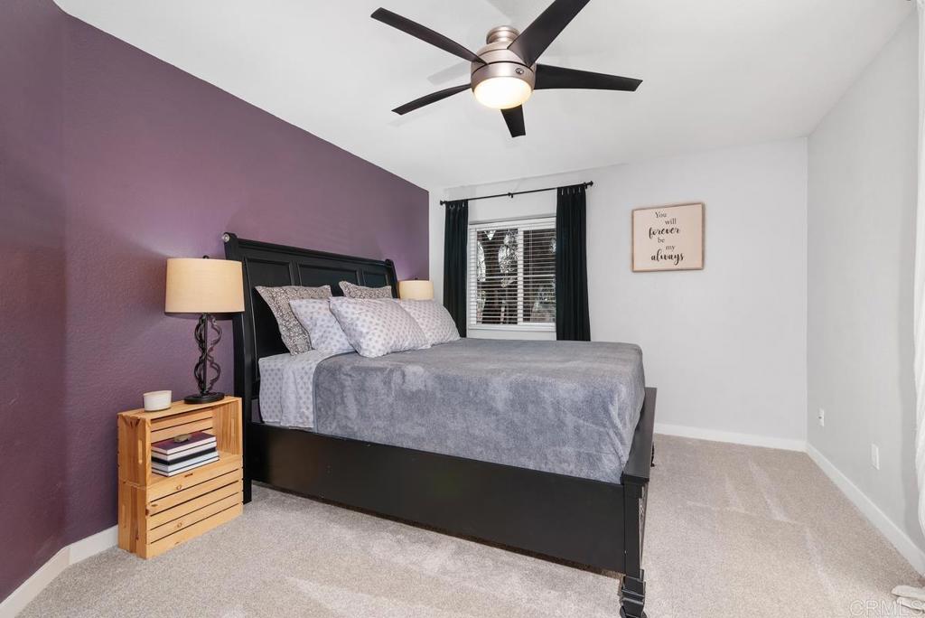 13981 Midland Road Poway, CA 92064 - Photo 10 of 26 a bedroom with a bed and a chandelier