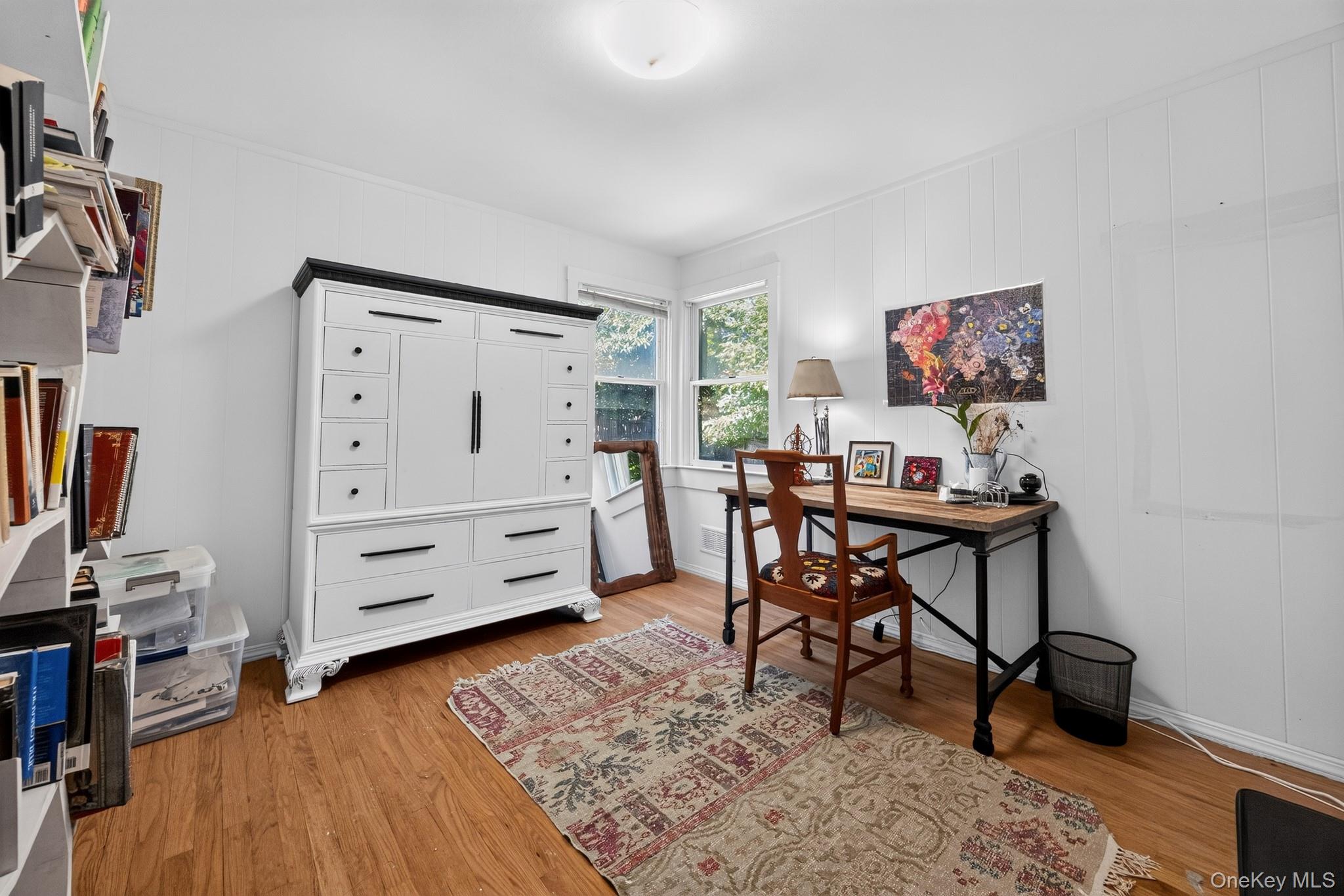 2 Terrace Road Suffern, NY 10901 - Photo 9 of 19 Wood-finish flooring, white paneling, and an overhead light fixture