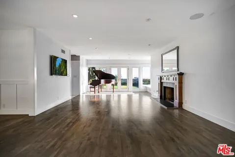 a large kitchen with stainless steel appliances granite countertop a stove and a sink