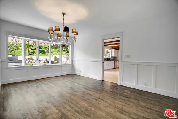 a kitchen with granite countertop a refrigerator and a stove