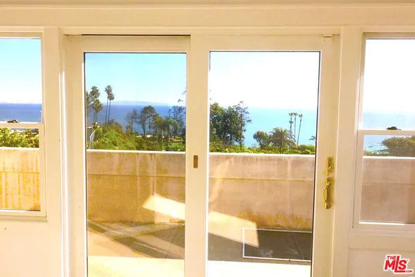 a bathroom with a shower sink and mirror