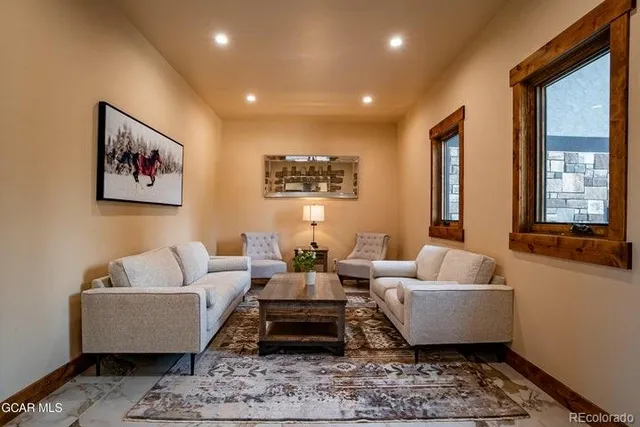 a living room with furniture and a window