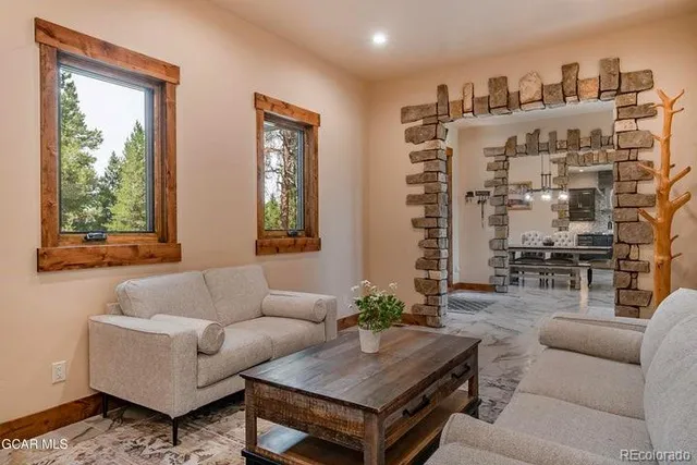 a living room with furniture and a large window