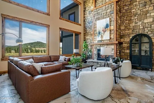 a view of a patio with couches chairs and a potted plant