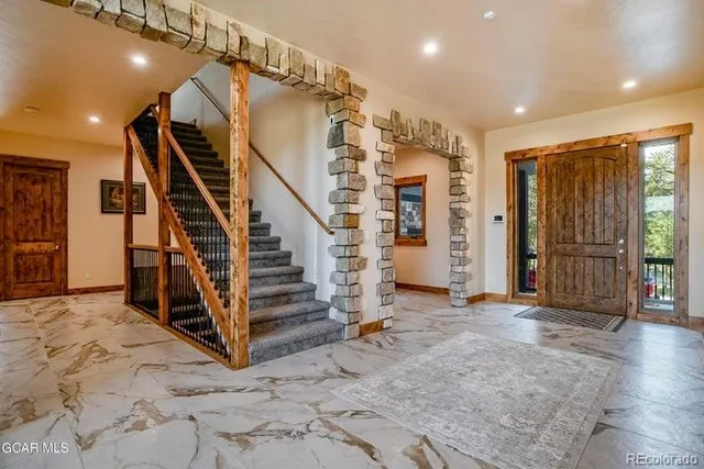 a view of a hallway with staircase