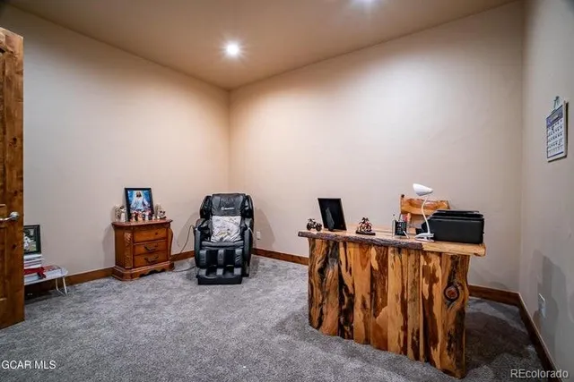 a bed room with furniture and a ceiling fan