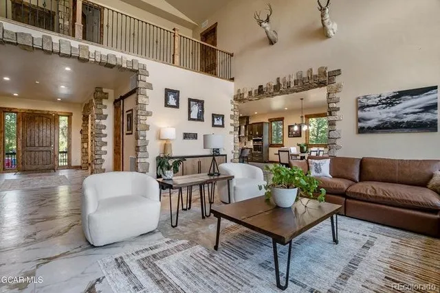 a living room with furniture and a table