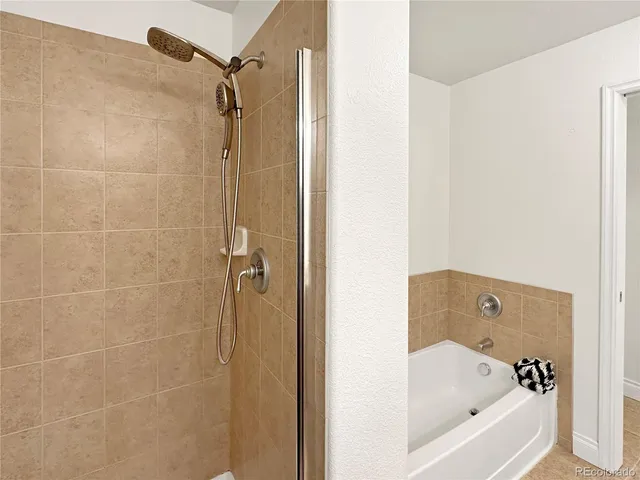 a view of bathroom with washer and dryer
