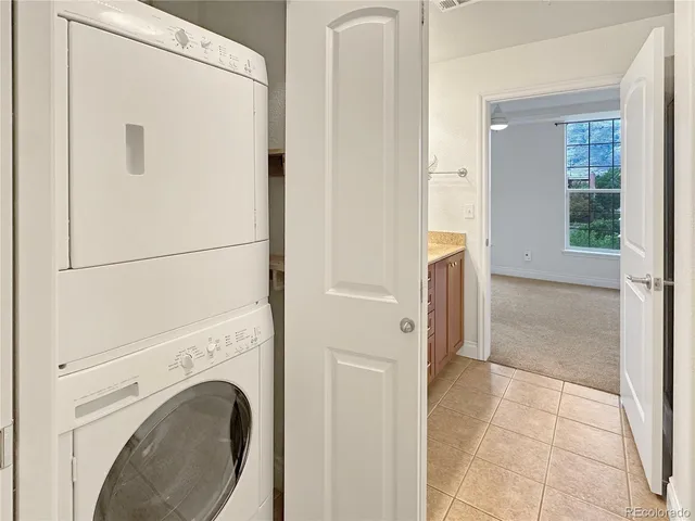 a bathroom with a granite countertop sink a large mirror and a shower