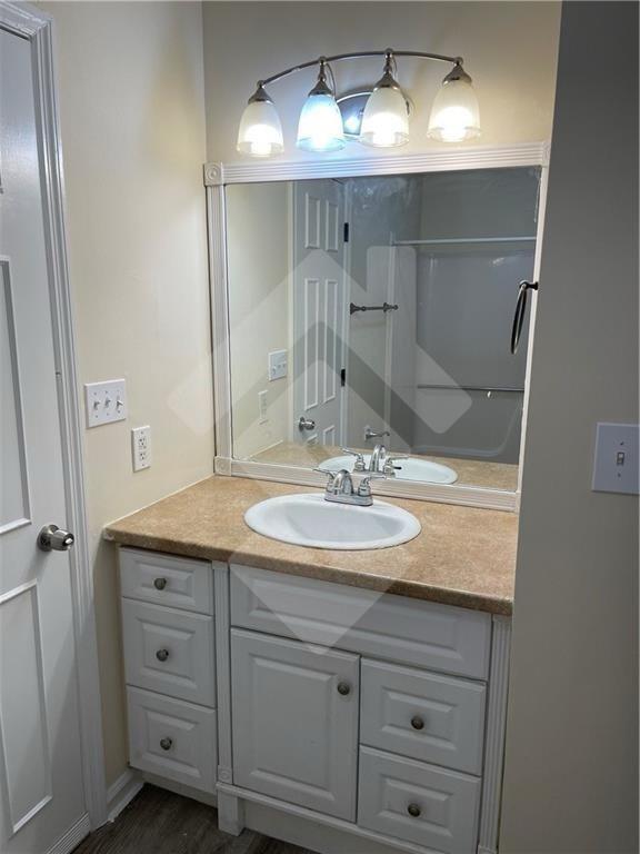 4267 Grogan Street Acworth, GA 30101 - Photo 24 of 37 a bathroom with a granite countertop sink and a mirror