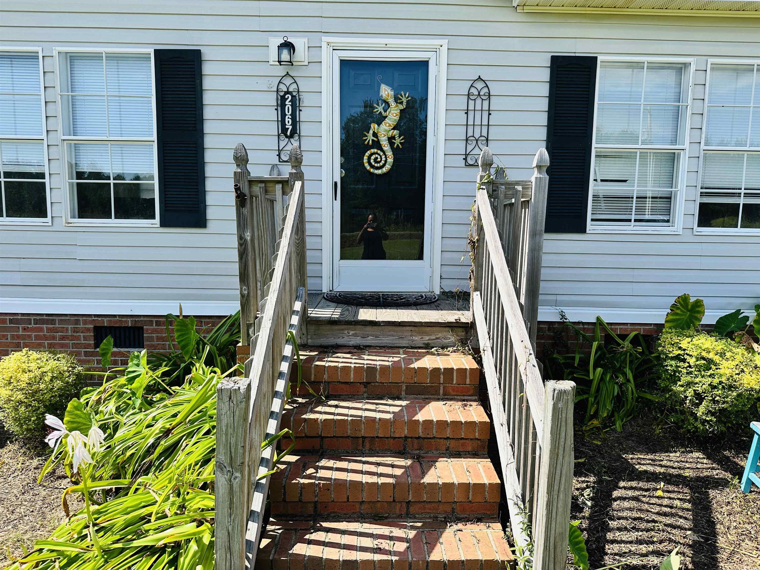 2067 Willow Creek Road Effingham, SC 29541 - Photo 12 of 40 Doorway to property featuring crawl space