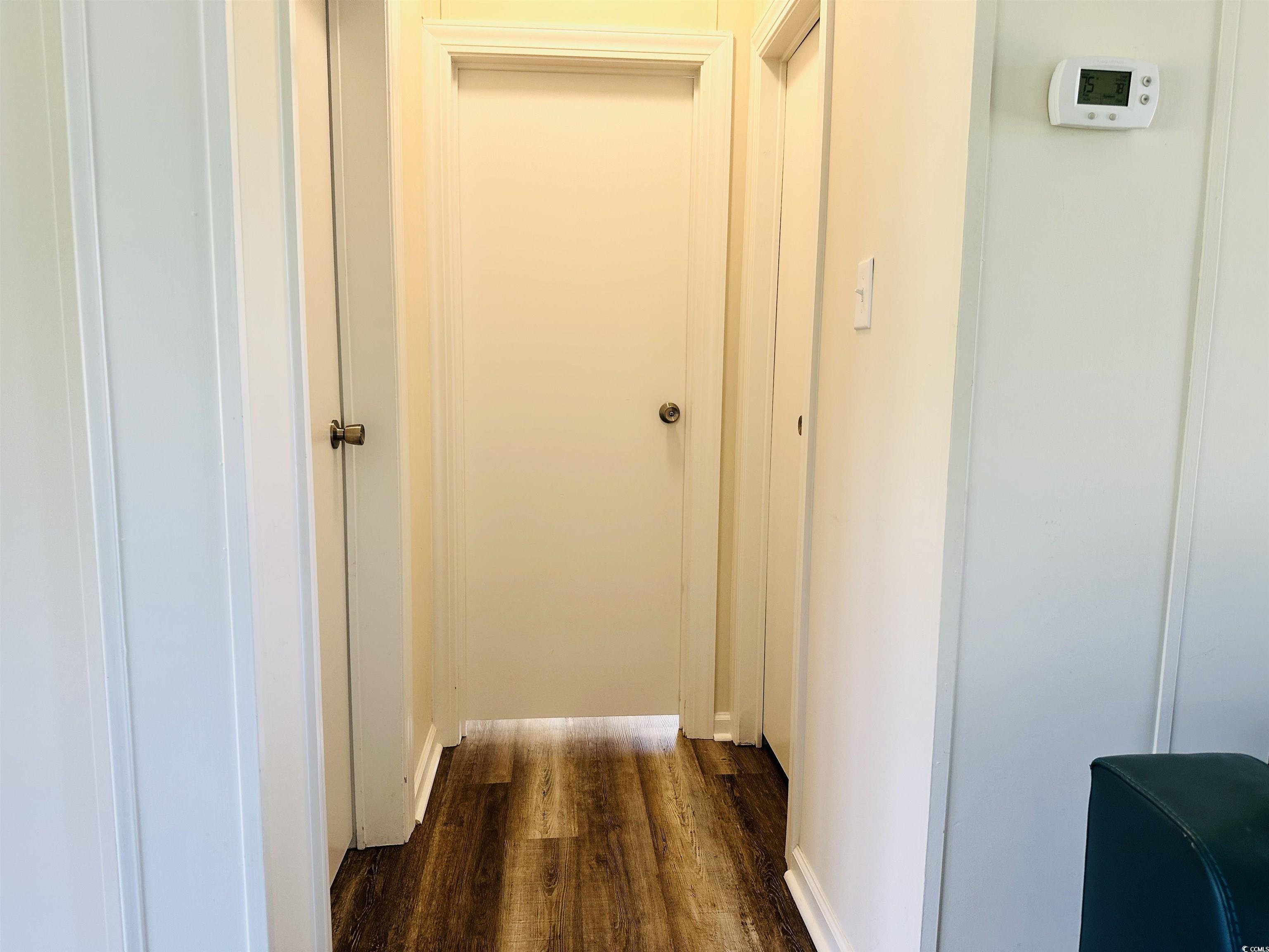 2067 Willow Creek Road Effingham, SC 29541 - Photo 18 of 40 Hallway with dark wood-style flooring