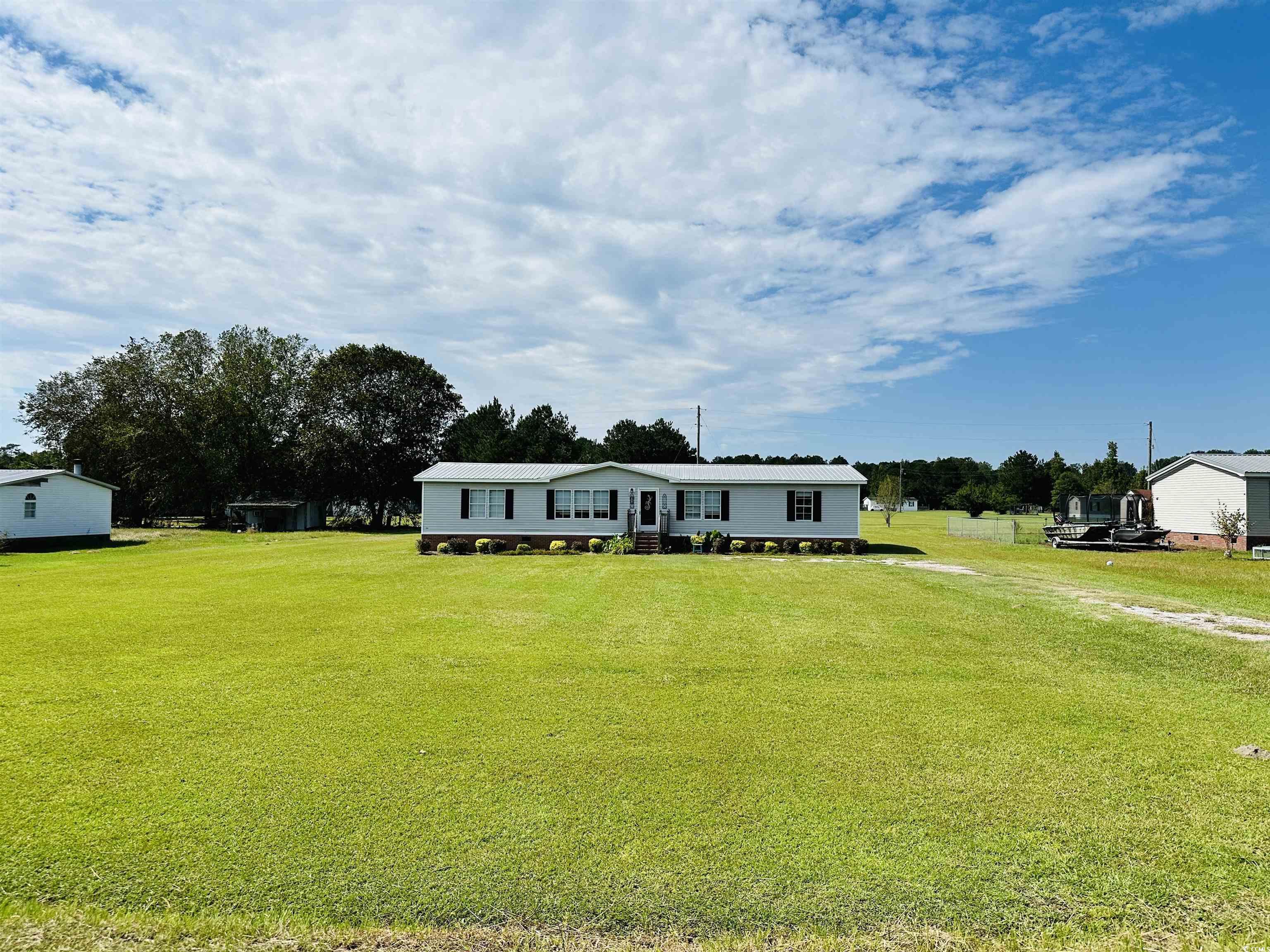 2067 Willow Creek Road Effingham, SC 29541 - Photo 2 of 40 Manufactured / mobile home with a front lawn